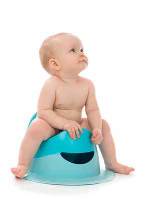 Infant child baby boy toddler sitting on potty toilet stool pot isolated on a white background